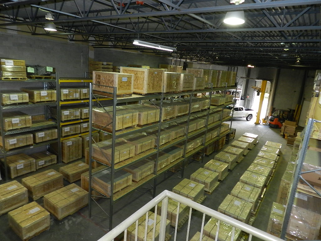 Warehouse racking detail — shelves loaded with labelled crates